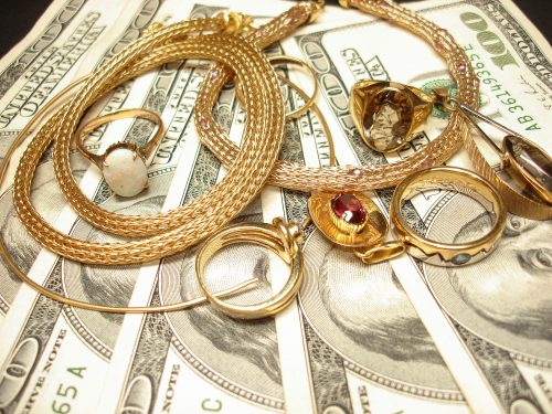 Image of Jewellery over United States Currency